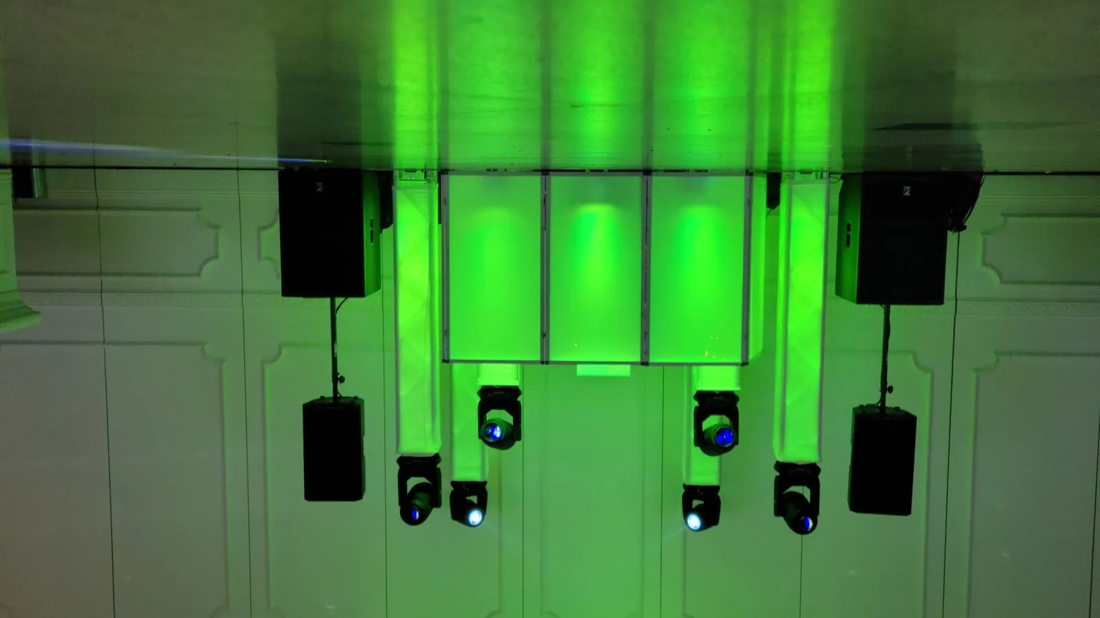 The Disaronno Events DJ booth at Da Noi on Staten Island — moving-head lighting and uplighting washing the room green