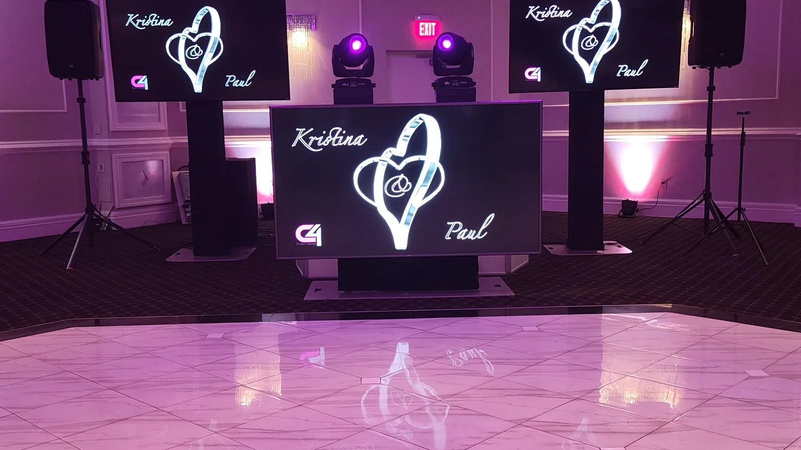 The Disaronno Events setup at Wilshire Caterers in West Orange NJ — LED screens carrying the couple's monogram, moving-head lighting and uplighting around the dance floor