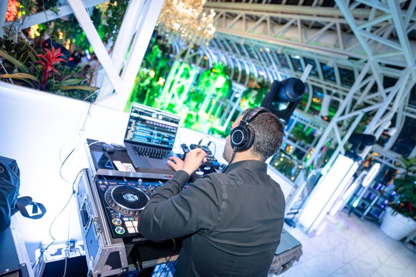 Packed dance floor under stage lighting